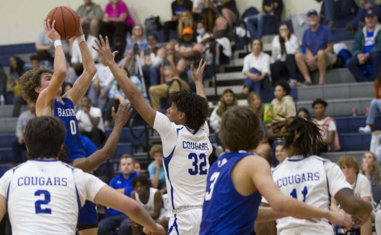 Nate Borchardt goes up over a Jarrell defender for a shot on his way to a 32-point night against the Cougars. HUNTER KING | DISPATCH RECORD
