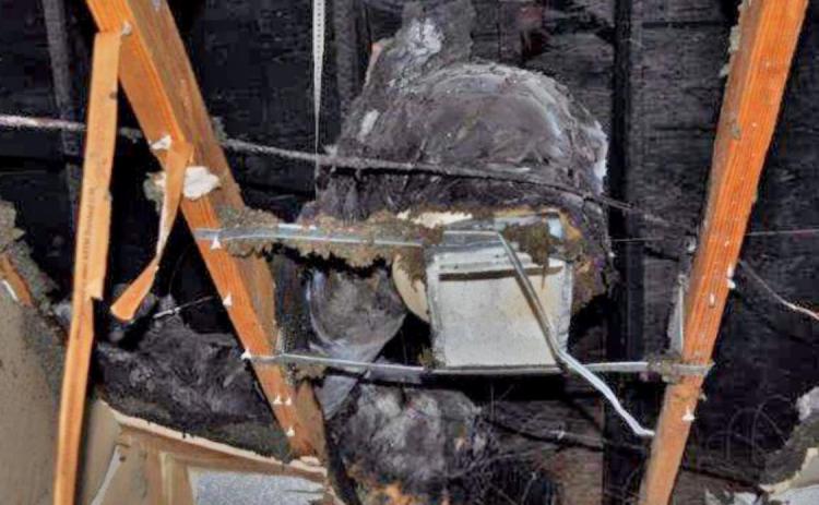 Damage is visible in the living room and attic area of a house in east Lampasas County after a fire Sunday night. COURTESY PHOTO