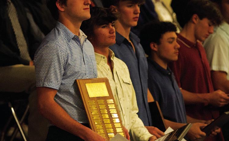 Bryson Roberts, left, stands with the Battlin’ Badger award from last Monday night. HUNTER KING | DISPATCH RECORD