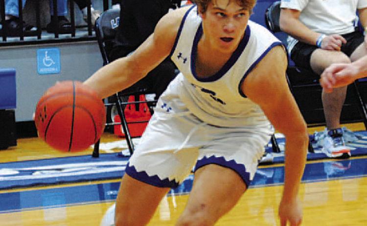 Haegan Oncken drives down the baseline and looks for a teammate. HUNTER KING | DISPATCH RECORD