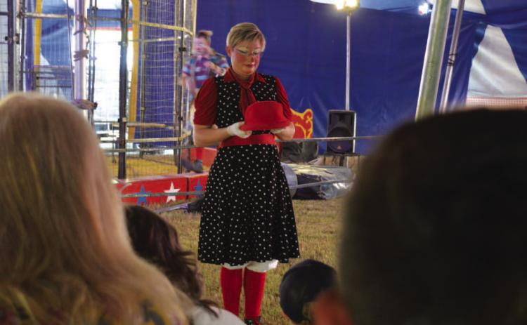 A Culpepper & Merriweather Circus clown entertains attendees before Monday’s show gets underway. ERICK MITCHELL | DISPATCH RECORD