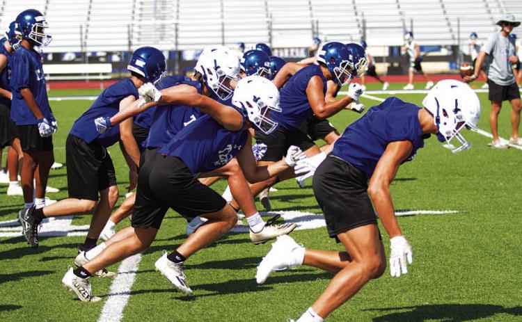 All the practices in temperatures over 100 degrees has led up to tonight when the Badgers take the field in the season opener. HUNTER KING | DISPATCH RECORD