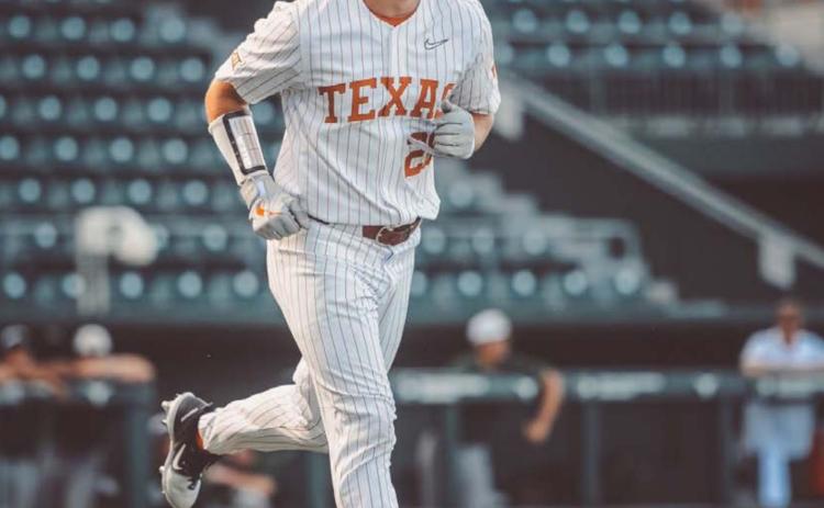 Ace Whitehead walks down to first base last Sunday after drawing a walk in one of his at-bats during the first fall scrimmage for the Longhorns. COURTESY PHOTO