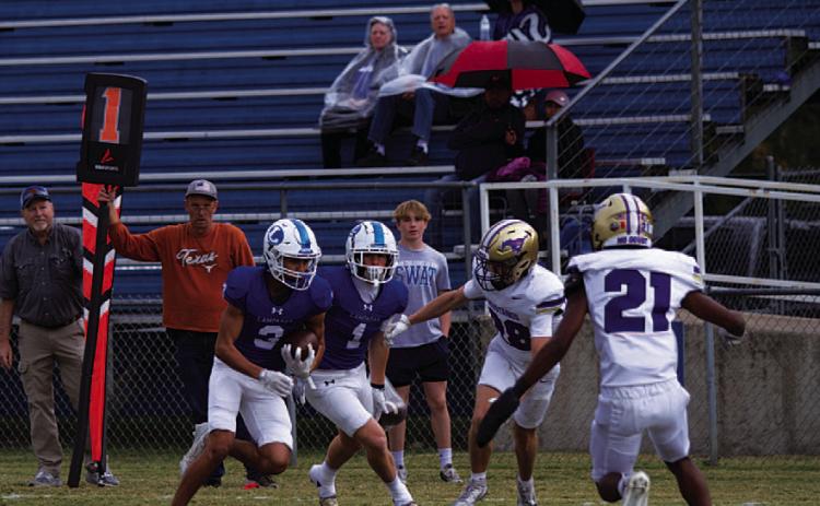 Tripp Stinnett evades Marble Falls defenders to get to the goal line for his touchdown. HUNTER KING | DISPATCH RECORD