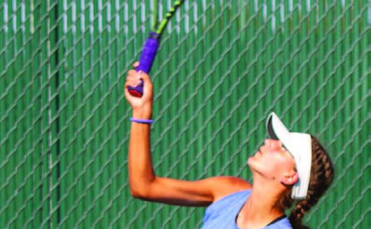 First line girls’ player Madelynn White and her doubles partner, Tayler Sheard, made quick work of their Marble Falls opponents, winning 6-1, 6-4. ANA SOFIA MEYER | DISPATCH RECORD