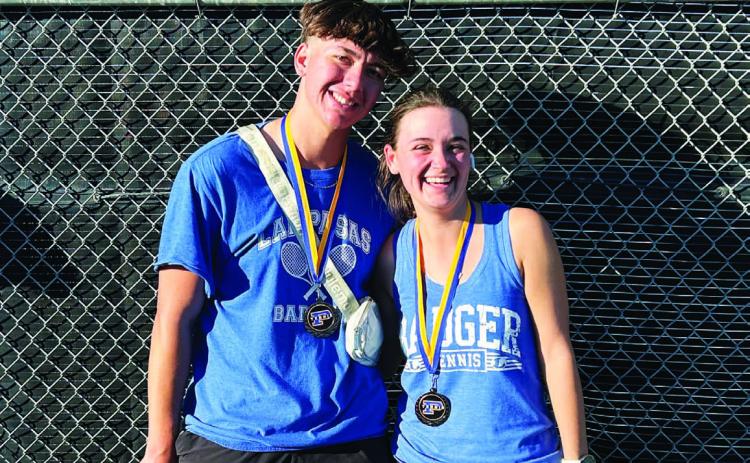 COURTESY PHOTO | KENNETH PEISER Clyde Ashfield, left, and Caroline White pose with their medals from last week’s tournament.