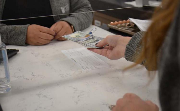 A proposed bill before Congress seeks to have banks inform the Internal Revenue Service of customer accounts with total annual deposits or withdrawals of $600 or more. Local and state banking officials have expressed opposition to the proposal. MONIQUE BRAND | DISPATCH RECORD