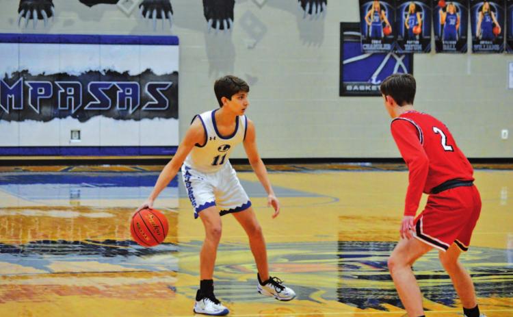 Luke Shivers dribbles and looks for a teammate to pass to during the Badgers’ game against Salado last week. HUNTER KING | DISPATCH RECORD