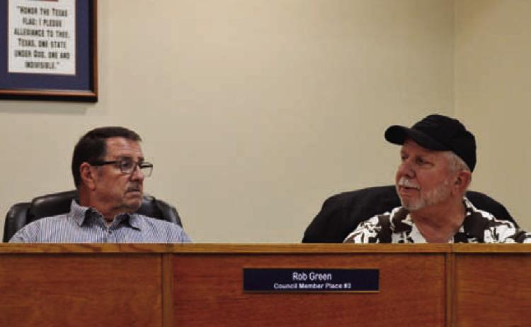 Councilmen Rob Green, left, and Thomas Combs discuss the proposed 2026-2027 budget for the city of Kempner. Elimination of a setaside for a future municipal court judge salary has enabled the Kempner City Council to lower the tax rate for the upcoming year. ERICK MITCHELL | DISPATCH RECORD