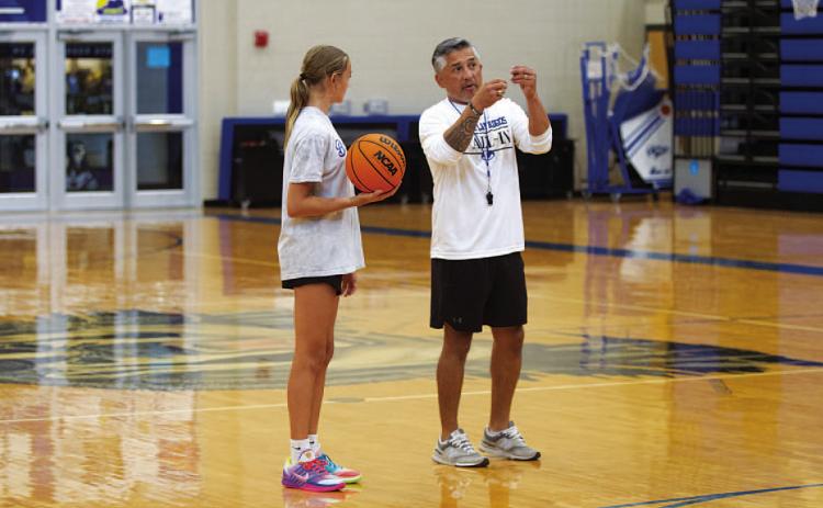 HUNTER KING | DISPATCH RECORD Girls’ basketball coach Marcus Chapa coaches up Corley Eckermann during the girls’ basketball camp last Wednesday.