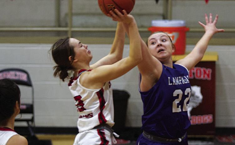 Kenedi Smart blocks a shot during the second half of Tuesday’s game. HUNTER KING | DISPATCH RECORD