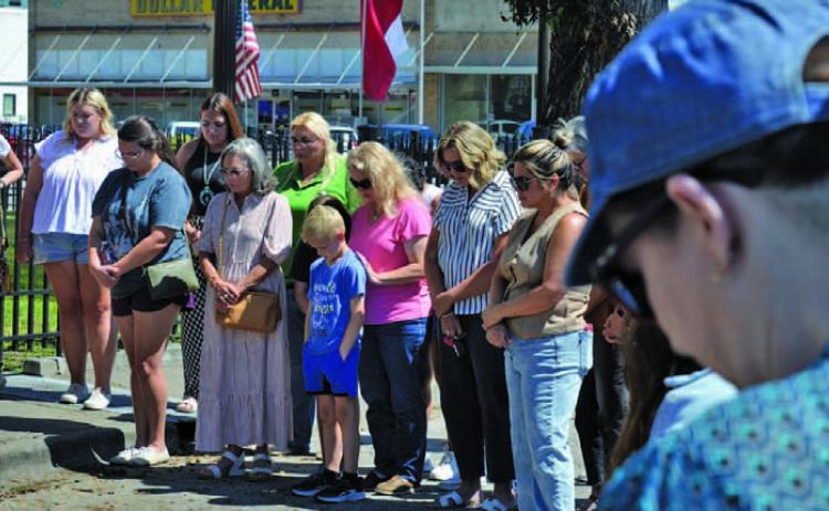 Lampasas residents gathered around the county courthouse Thursday in a moment of prayer for the nation 24 years after the Sept. 11 attacks and the day after the murder of Charlie Kirk, a conservative activist and Turning Point USA co-founder. ERICK MITCHELL | DISPATCH RECORD