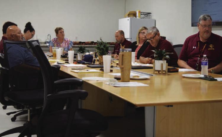 The Lometa school board listens to a presentation about the district’s afterschool program, which may be discontinued next year due to decreased grant funding available from the Central Texas Council of Governments. ERICK MITCHELL | DISPATCH RECORD