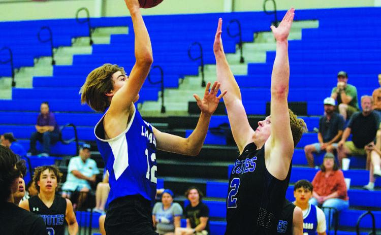 HUNTER KING | DISPATCH RECORD Jax Pratus tosses a floater toward the basket during last year’s summer league here in Lampasas.
