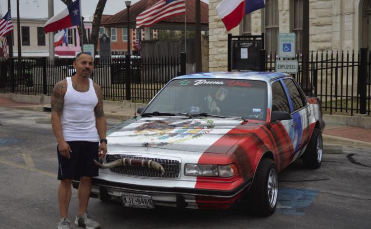 Lampasas resident Robert Sanzhez stands next to his 1991 Buick Century outside the Lampasas County Courthouse. The Mexican coat of arms that is present on the Mexican flag of a golden eagle eating a rattlesnake can be seen on the hood of the car. ERICK MITCHELL | DISPATCH RECORD
