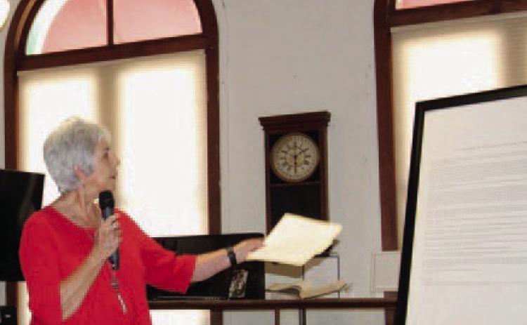 Mayor TJ Monroe, standing at the Lampasas County Museum, reads the proclamation opening a year of celebration for the Lampasas sesquicentennial. JOYCESARAH MCCABE | DISPATCH RECORD