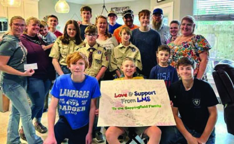 Front and center, Luke Sappenfield is surrounded by family members and Scouts from Troop 200, Troop 400 and Pack 100 who have helped raise funds for the Sappenfields’ medical expenses. COURTESY PHOTO