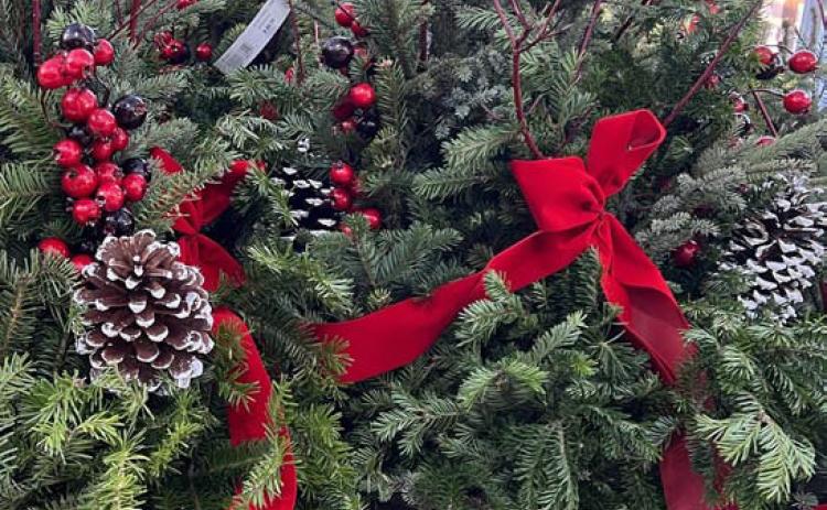 Containers filled with greenery, colorful stems, cones, berries and more can brighten the landscape all winter long. COURTESY PHOTO | WWW.MELINDAMYERS.COM