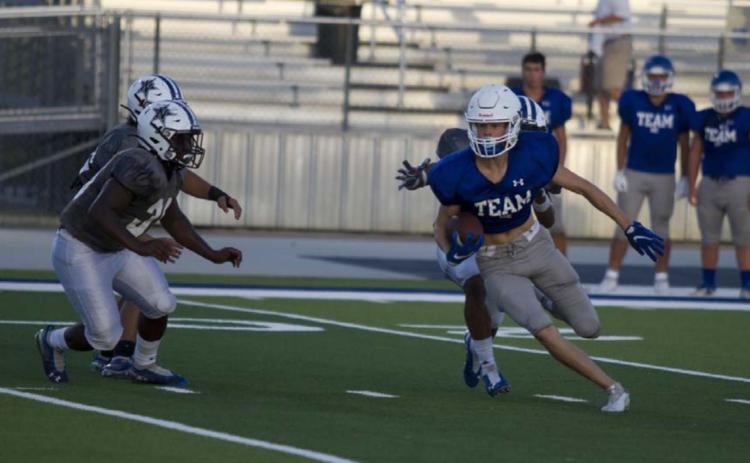 Nate Borchardt darts through the Navasota defense after a catch over the middle. Borchardt finished with two touchdowns during the second tune-up for the Badgers. HUNTER KING | DISPATCH RECORD