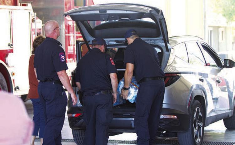HUNTER KING | DISPATCH RECORD Lampasas Fire Department served as an emergency water station Wednesday. Residents could pick up bottled water, and a limited supply of non-potable water also was offered to those in need.