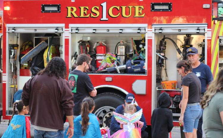 Lampasas Fire Department officials participated in handing out candy during last weekend’s Squared Silly celebration on the downtown courthouse square. For more photos and costume contest results, see page 3. JOYCESARAH MCCABE | DISPATCH RECORD