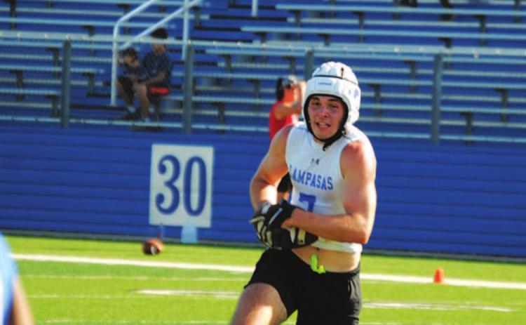 Carter Johnson runs up the middle of the field in Monday’s game. HUNTER KING | DISPATCH RECORD
