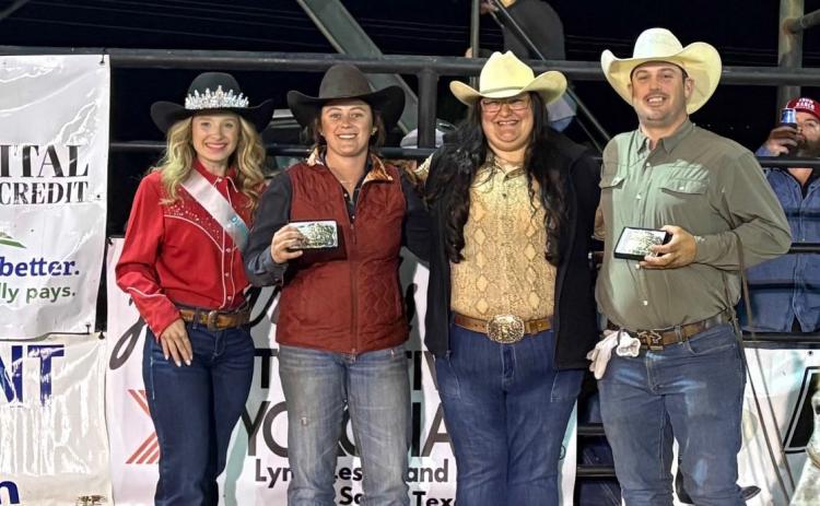 Rodeo Queen Karlee Parker, at left, helps congratulate the team roping winners as they show off their buckles. The event was sponsored by Capital Farm Credit of San Saba. COURTESY PHOTO | TERRI HARRIS