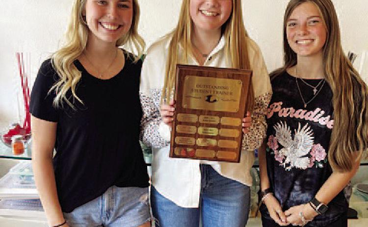 COURTESY PHOTO | JAN BRISTER Greenlee Chism, left, Emily Tower and Kewe Sanford earned trainer of the year honors.