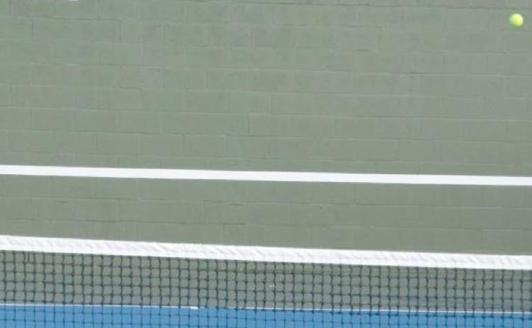 Hannah Durbin, left, and Allison Valdez play doubles in the Pflugerville tournament that they won on Thursday. KENNETH PEISER | COURTESY PHOTO