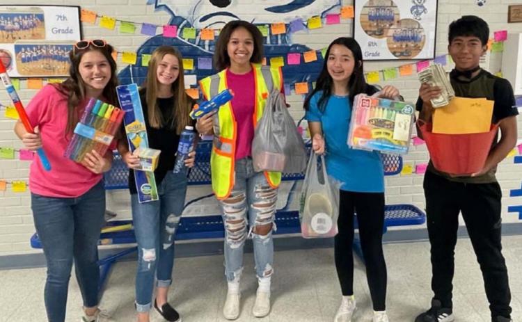 Lampasas Middle School National Junior Honor Society students collected toy donations and raised funds for children in the Lampasas CPS program. Pictured from left to right are Jacie Resa, Sagen Plouff, Laylah Bryant, Toby Brooks-Potter and Juan Rodriguez. courtesy photo