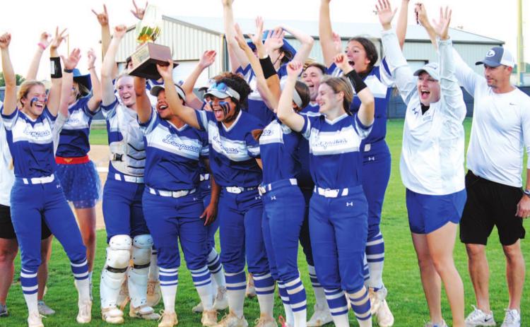 The Lady Badgers celebrate with their bi-district championship trophy after beating Graham last Friday night. HUNTER KING | DISPATCH RECORD