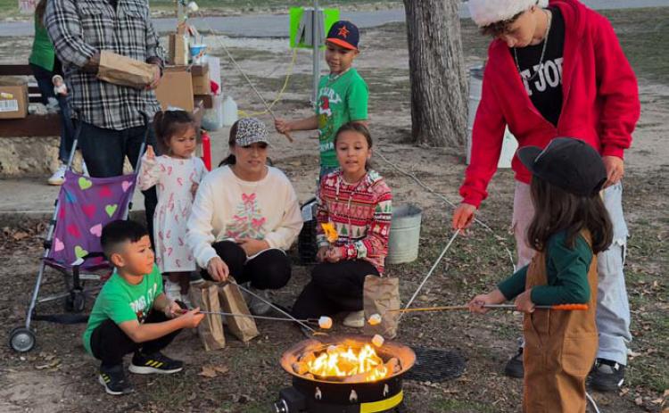 Christmas on the Creek visitors were treated to s’mores by Girl Scout troops during Saturday’s festivities. ADAM BARRIOS | DISPATCH RECORD
