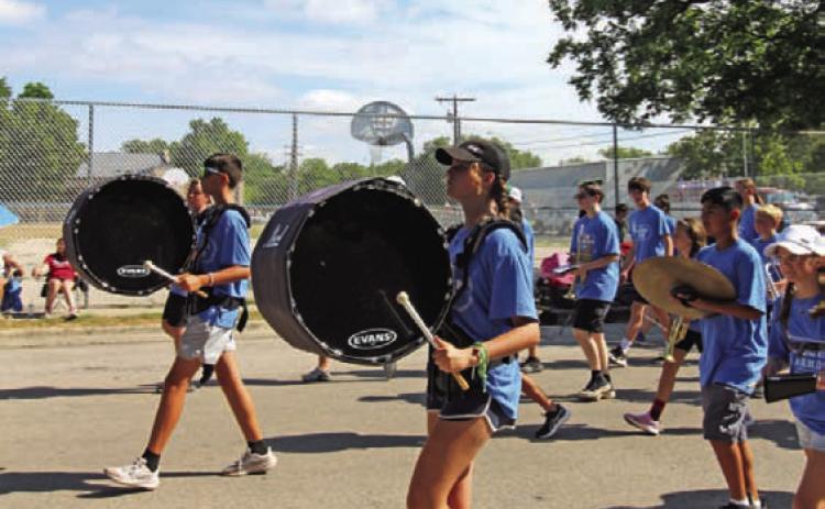 JOYCESARAH MCCABE | DISPATCH RECORD The Lampasas High School Badger Band marches with enthusiasm despite the warm temperatures at parade time last Saturday.