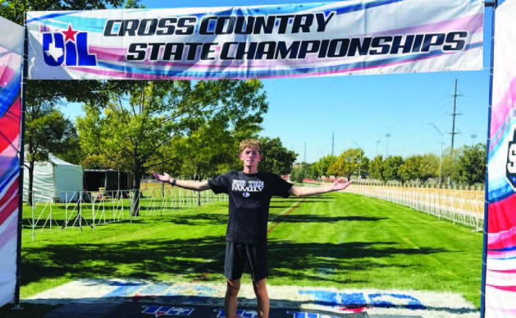 COURTESY PHOTO | KIM BURNSIDE John Keyes poses for a photo at the finish line of the state cross country meet.