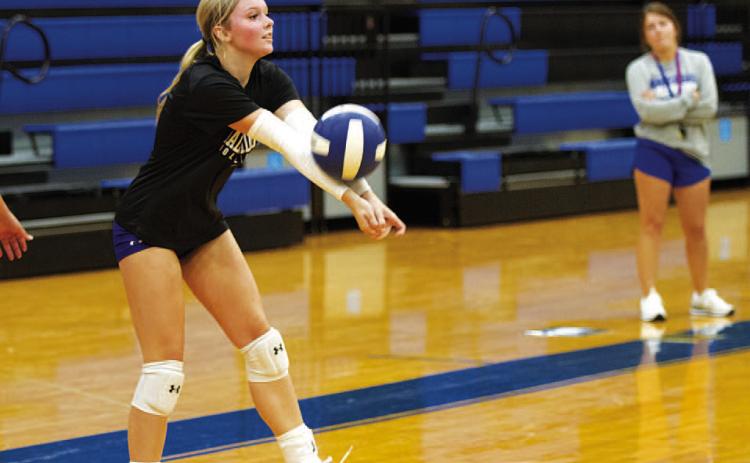 HUNTER KING | DISPATCH RECORD Scout Barton works on serve receive during volleyball practice Monday morning.