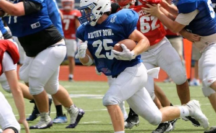 Badger grads play together one last time on gridiron