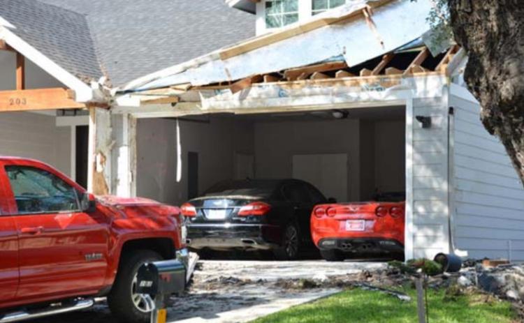 Damage at 203 S. Howe St. was visible in May after a car crashed into the house. Police alleged the driver was intoxicated and going 117 mph in the residential neighborhood. FILE PHOTO