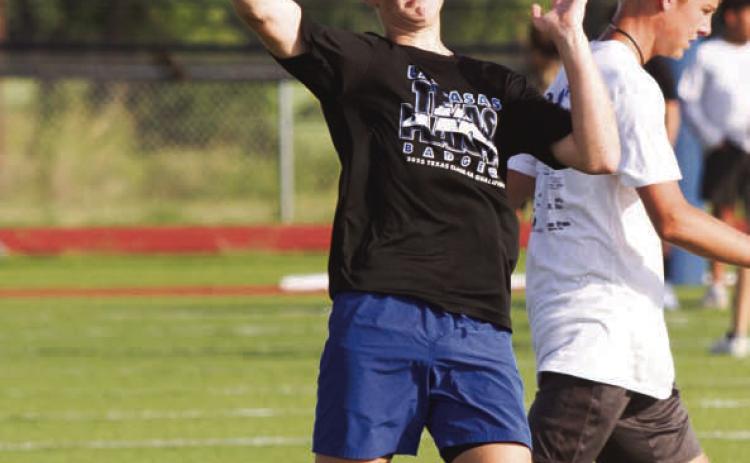 Incoming freshman Kaiser Morua launches a pass on Monday morning during a three-day camp held at Lampasas High School. ERICK MITCHELL | DISPATCH RECORD