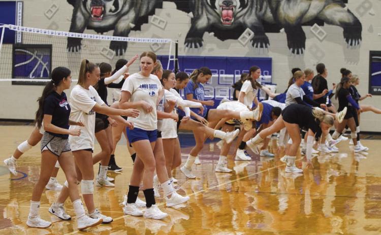The Lampasas High School Lady Badger volleyball team goes through their warm-up routine before practice on Tuesday. ERICK MITCHELL | DISPATCH RECORD