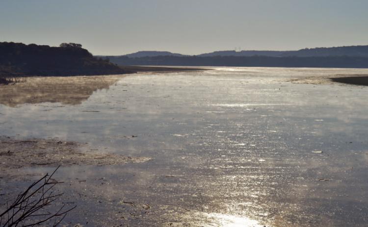 The sum shines on Stillhouse Hollow Lake, home to the Kempner Water Supply production plant. After hitting a low lake level of 601 feet in October, the water is now just above 604 feet. ERICK MITCHELL | DISPATCH RECORD