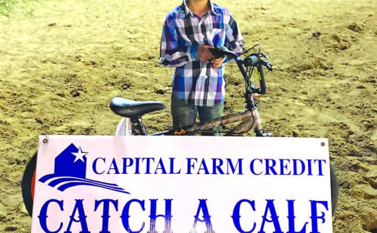 Gabriel Moore won the 6 and under calf scramble on March 25 at the Lometa Diamondback Jubilee Rodeo. He earned a bike for his efforts. The event was sponsored by Capital Farm Credit. COURTESY PHOTO | MARCUS AMTHOR