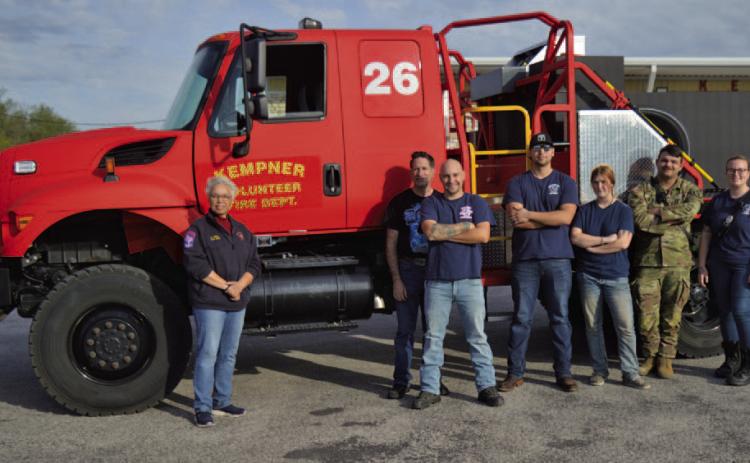 Kempner VFD Chief Connie Green stands at left, alongside Kempner volunteer firefighters, in front of the new brush truck the department received earlier this month. ERICK MITCHELL | DISPATCH RECORD
