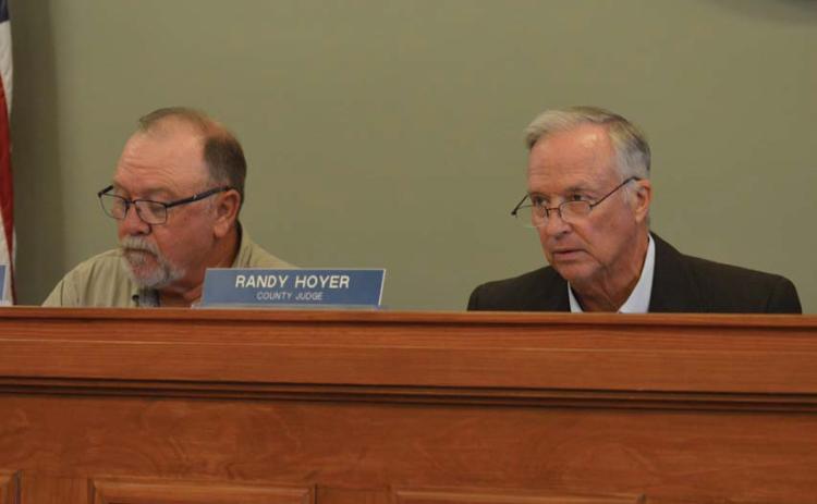 Precinct 3 Commissioner Shad Hill, left, and County Judge Randy Hoyer listen to a presentation Monday about eligibility for Lampasas County to receive some funding from the Federal Emergency Management Agency. erick mitchell | dispatch record
