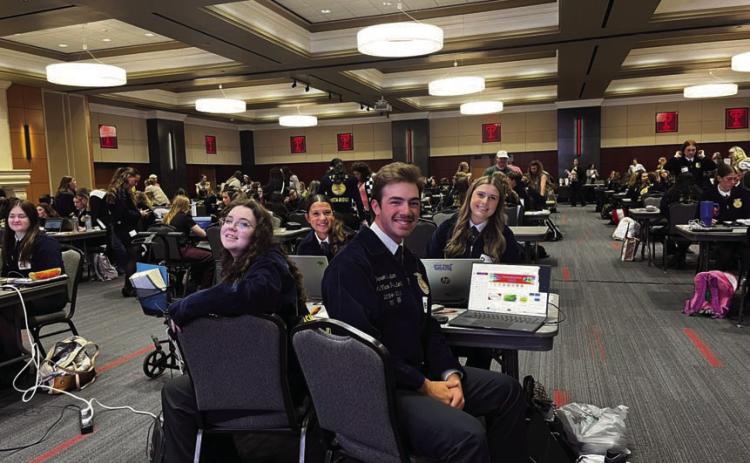 Lampasas FFA Agriculture Communications team members -- back row from left, Emory Vineyard and Chandler Boultinghouse, and front row, Cara Fitzner and Darren Tristan -- pose during the state competition held May 2-3 at Texas Tech University. COURTESY PHOTO