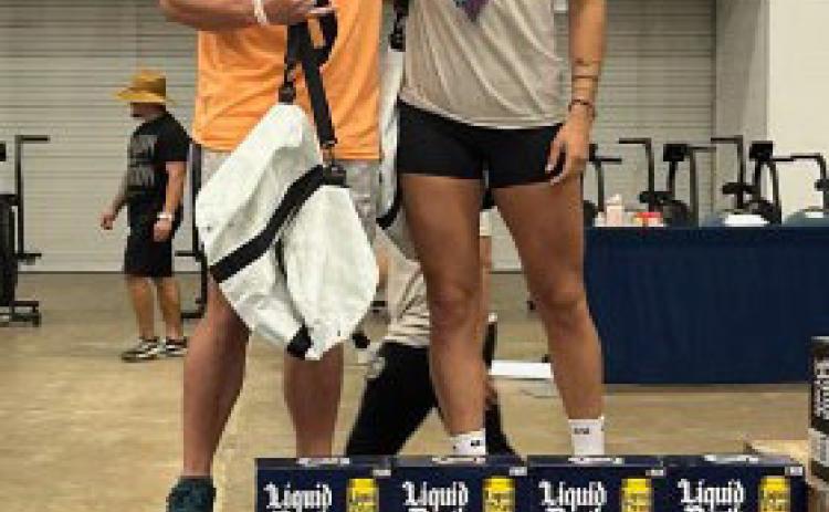 Astin Murray, left, and Natalee Johnson smile on the podium. COURTESY PHOTO