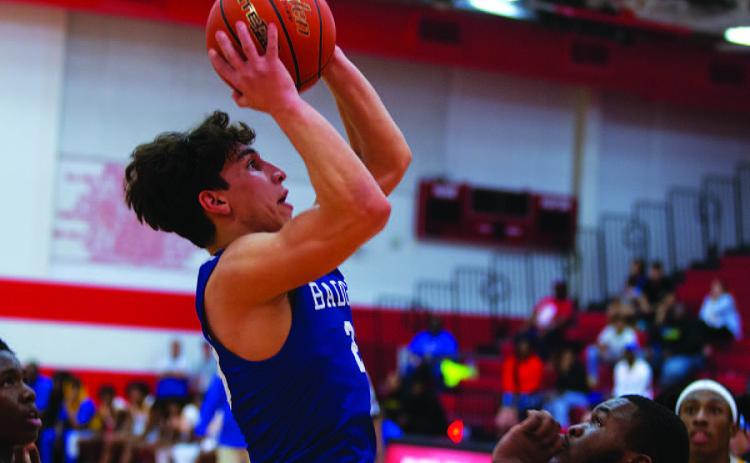 HUNTER KING | DISPATCH RECORD Ethan Moreno shoots over a Waco La Vega defender for two points in Tuesday’s playoff matchup.