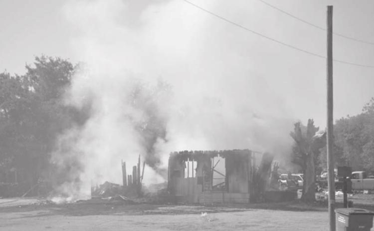 This structure burned until around 10 a.m. Wednesday, when firefighters from four agencies were able to contain the blaze. MASON HINES | DISPATCH RECORD