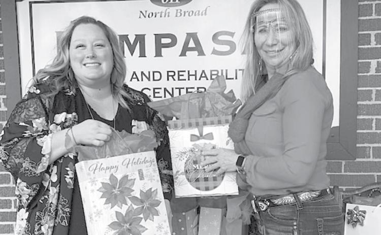 Courtney Carnley, left, delivers gift bags to Mary Creek for seniors at Lampasas Nursing &amp; Rehabilitation Center. COURTESY PHOTO