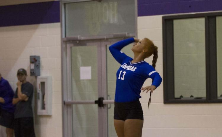 Juliana Dwamena goes up for a serve during a match in Florence earlier this season. Dwamena has been one of the team leaders in both kills and blocks this season. HUNTER KING | DISPATCH RECORD