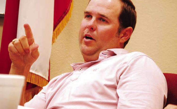 Lampasas ISD Trustee Ryan Shahan discusses with his colleagues about a new ag barn at Monday’s school board meeting. HUNTER KING | DISPATCH RECORD